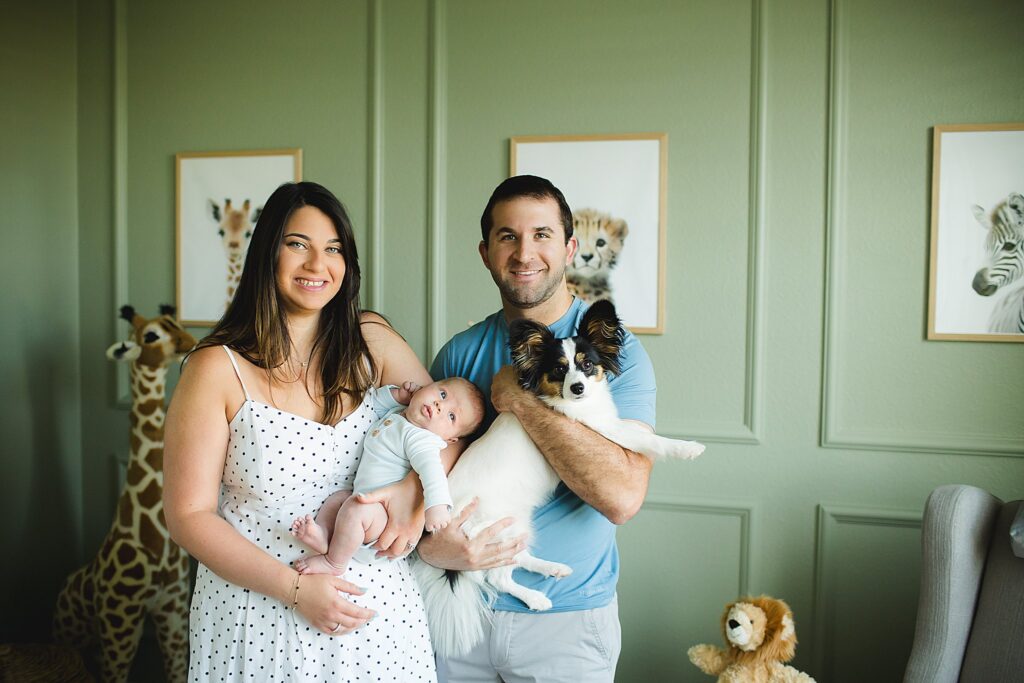 Orlando newborn photographer capturing baby in parents arms at home
