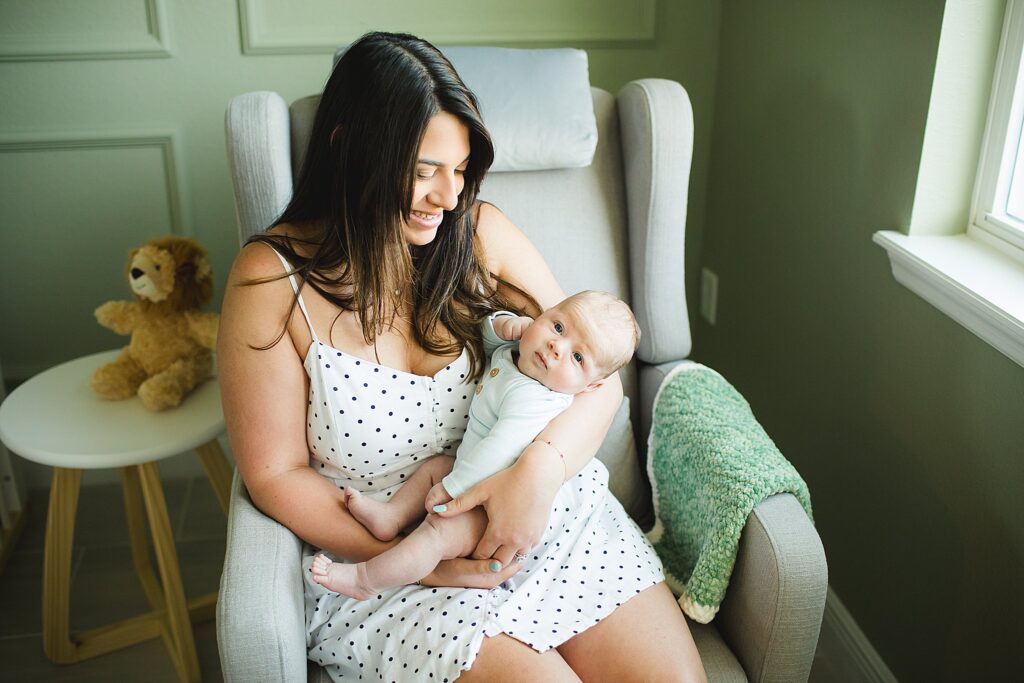 Orlando newborn photographer capturing baby in parents arms at home