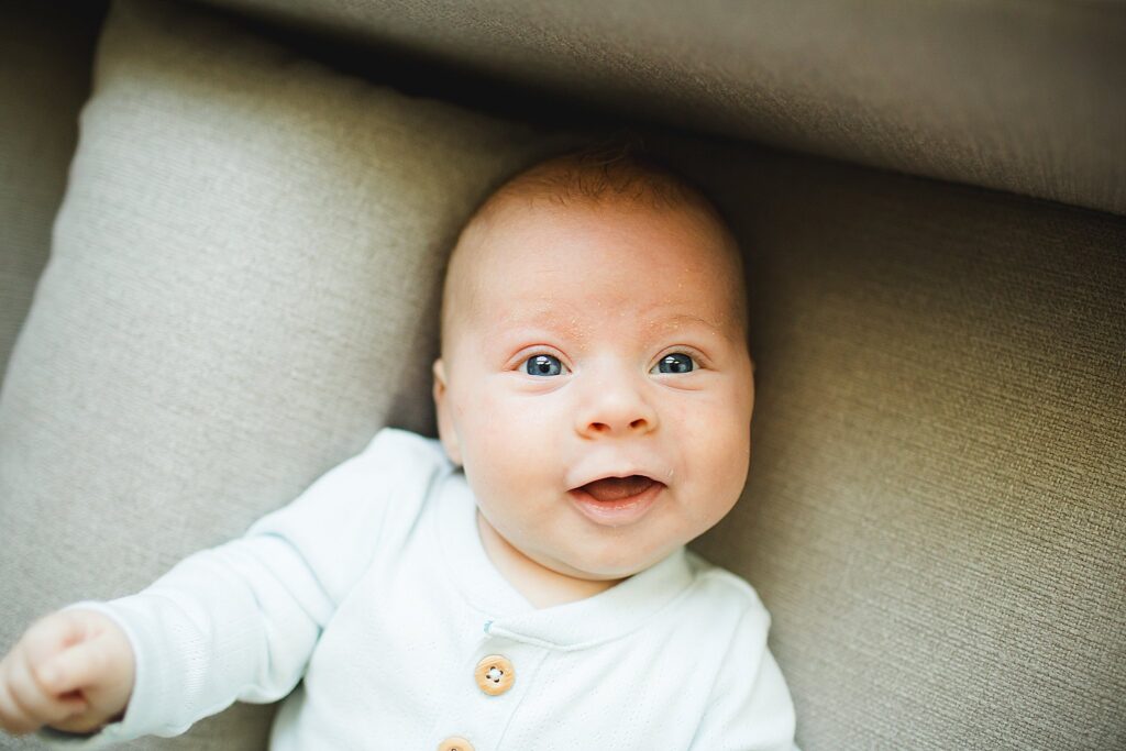 Orlando newborn photographer capturing baby in parents arms at home