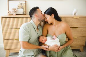 Newborn family photo of mom and dad
