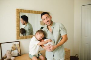 newborn sibling photo